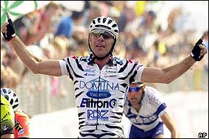 Italy's Giovanni Lombardi celebrates as he crosses the finish line to win the 20th stage of the Tour of Italy cycling race from Cannobbio to Cantu