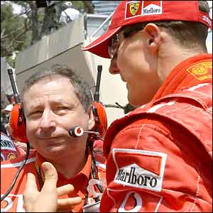 Michael Schumacher discusses tactics with Ferrari's Jean Todt 
