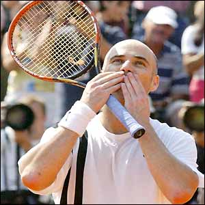 Andre Agassi blows kisses to the crowd after beating Flavio Saretta