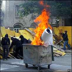 Barricade and burning bin in Lausanne