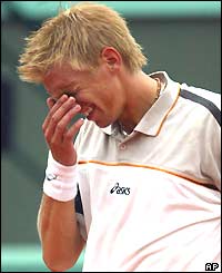 Finn Jarkko Nieminen holds his head in despair during his fourth-round defeat