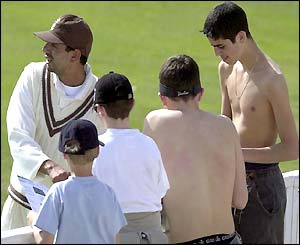 Surrey spin bowler Saqlain Mushtaq signs autographs for the fans