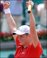 Belgium's Kim Clijsters reacts after defeating Spains Conchita Martinez in a quarter-final match 