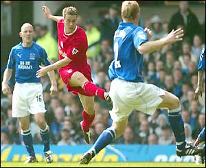 Michael Owen scores the opener against Everton