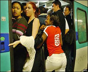 Passengers squeeze onto train