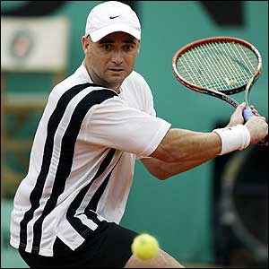 Andre Agassi hits a return during his quarter-final match