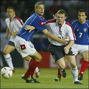 Wayne Rooney tries to break through the Serbia & Montenegro defence