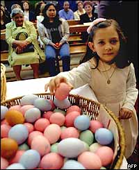 Child picking Easter egg in Beirut church