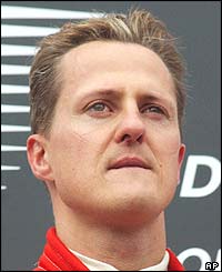 Schumacher stands on the winner's podium