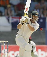 Adam Gilchrist hits a boundary for Australia 
