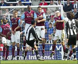 Nolberto Solano scores with a free kick