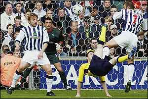 Tottenham striker Robbie Keane tries an overhead kick against West Brom