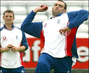 Richard Johnson bowls in training while James Kirtley watches
