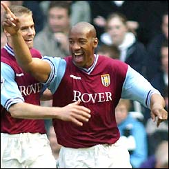 Dion Dublin celebrates his goal against Newcastle