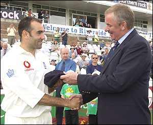 England debutant Richard Johnson receives his cap from chairman of selectors David Graveney