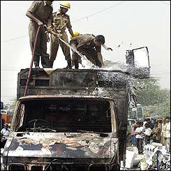 Delhi firemen deal with a truck which caught fire after overheating due to extemely hot weather 