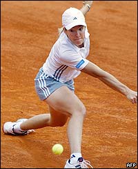Belgium's Justine Henin-Hardenne returns the ball 
