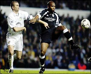 Barry Hayles (right) tries to get past Leeds captain Dominic Matteo