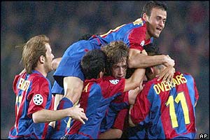 Barcelona's Luis Enrique, top, jumps on top of various team-mates after Xavi scores against Juventus