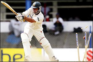 Darren Lehmann of Australia is bowled out by Merv Dillon 