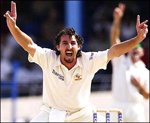 Australia's Jason Gillespie celebrates trapping Devon Smith lbw for a duck