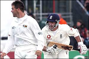 Heath Streak watches the ball as Ashley Giles sets off for a quick single for England