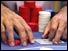 Hands holding casino chips and cards