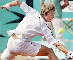 Juan Carlos Ferrero stretches for a backhand return