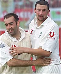 Richard Johnson and Steve Harmison celebrate bowling out Zimbabwe for 94