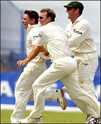 The Aussies celebrate after removing Carlton Baugh