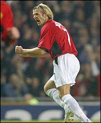 Man Utd's David Beckham celebrates scoring against Real Madrid