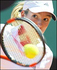 Justine Henin-Hardenne hits a return