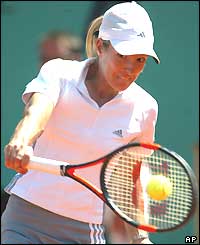 Justine Henin-Hardenne concentrates as she hits a backhand