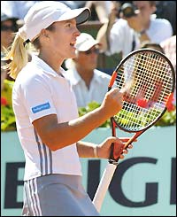 Henin-Hardenne clenches her fists with delight after winning the French Open title