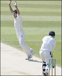 James Anderson celebrates taking the wicket of Stuart Carlisle, caught by Robert Key for 28