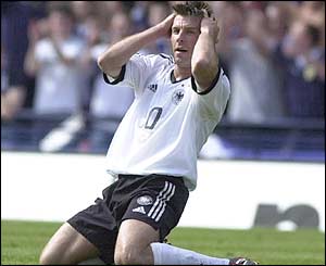 Bernd Schneider sees Rab Douglas make a great save from his free kick 