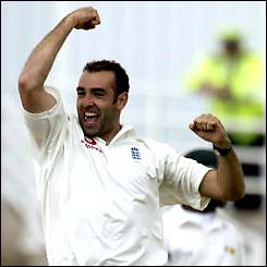 Richard Johnson celebrates a wicket on his debut