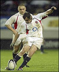 Paul Grayson kicks a conversion for England