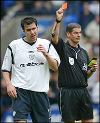 Bolton defender Florent Laville is sent off at the Reebok Stadium