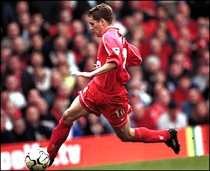 Michael Owen scores his third goal in Liverpool's 3-0 victory over Newcastle on 5 May 2001