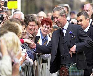 Prince of Wales is greeted by members of public as he walk along the Royal Mile in Edinburgh
