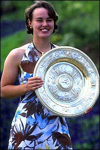 Martina Hingis poses with the Wimbledon trophy