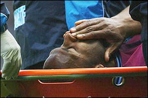West Ham striker Les Ferdinand is stretchered off