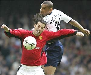 Ruud van Nistelrooy wins the ball against Dean Richards