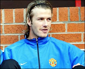 David Beckham warms the bench against Real Madrid in the Champions League