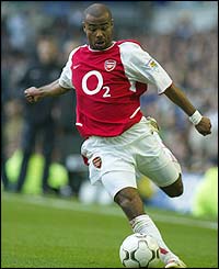 Arsenal left back Ashley Cole crosses the ball