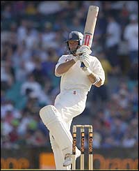 England's Nasser Hussain watches a shot go towards the boundary