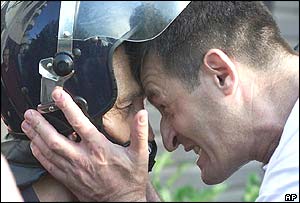 A Sljivancanin supporter confronts the commander of a riot police unit 