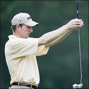 Jim Furyk lines up a putt during the second round