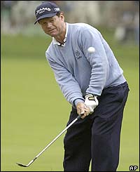 Overnight leader Tom Watson chips onto the sixth green 